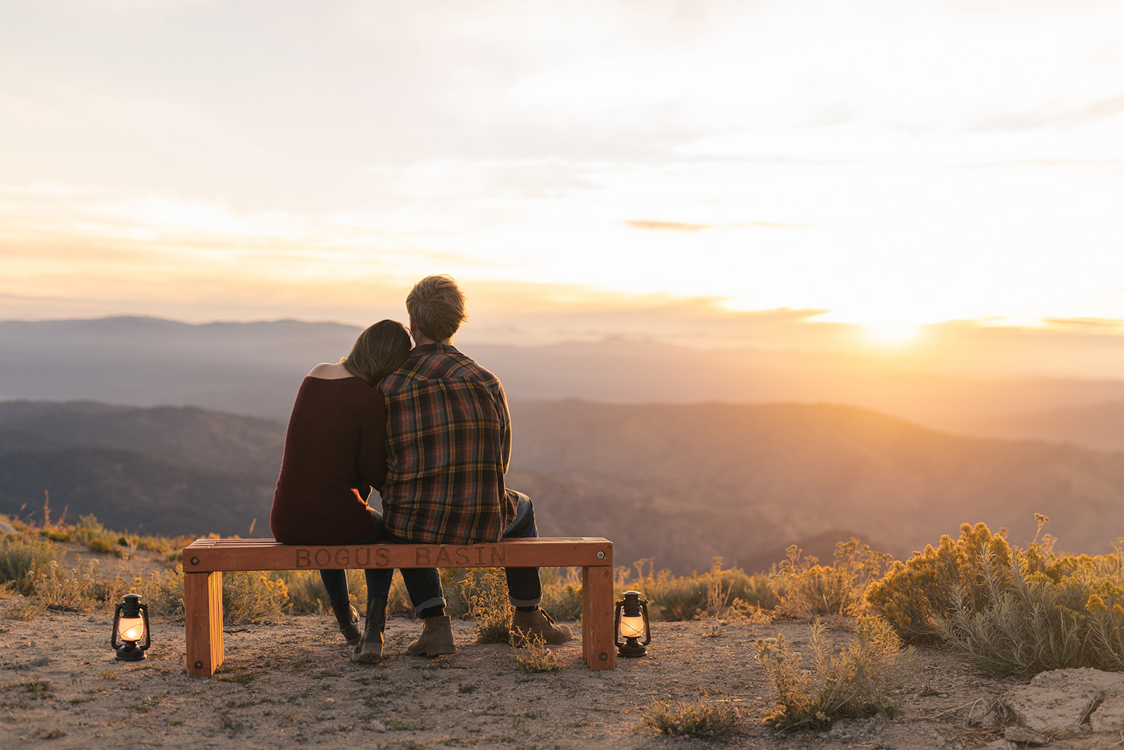 Boise Idaho Couples Engagement Session Video Couple sits on bench at sunrise