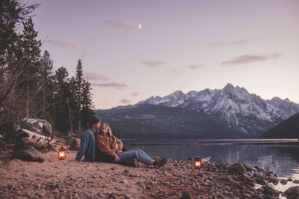 Couple enjoys Idaho's Sawtooth Mountains at Redfish Lake during their adventure film session with Odyssey Film and Photo. This was a favorite photo and film session featured in Odyssey's 2022 retrospective video.