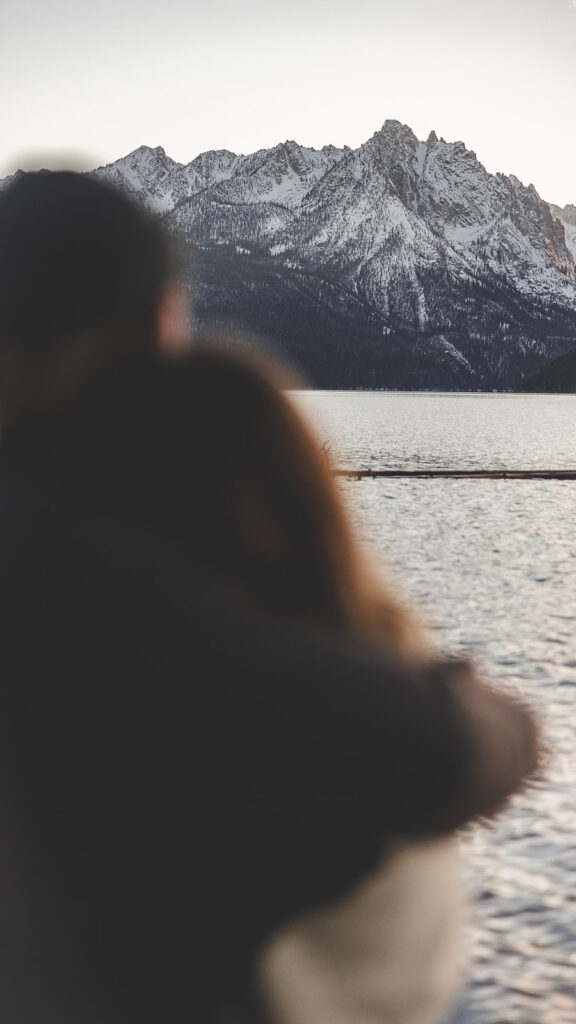 Couple gets engaged at the base of the Sawtooth Mountains for an Idaho wedding photographer.